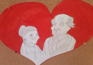 Obrazek babci i dziadka na tle czerwonego serca