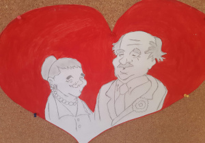 Obrazek babci i dziadka na tle czerwonego serca